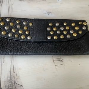 Black pebble leather clutch with studs.